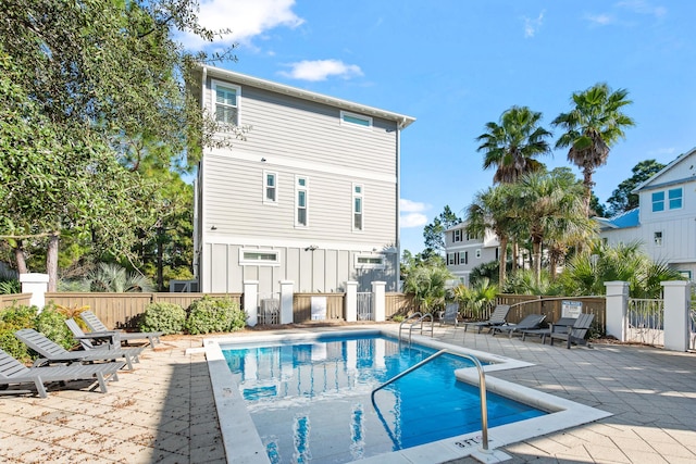 back of house featuring a patio area and a community pool