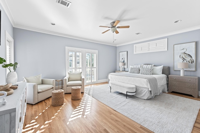 bedroom with ceiling fan, ornamental molding, and light hardwood / wood-style flooring