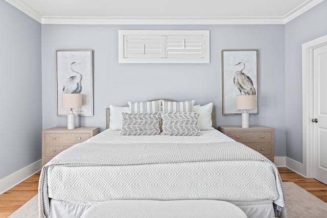 bedroom with crown molding and wood-type flooring