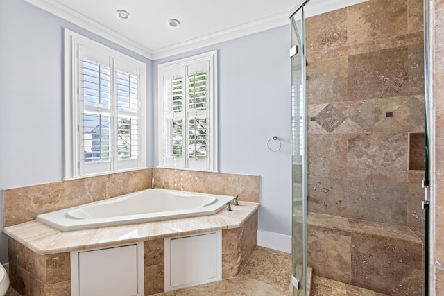 bathroom with ornamental molding and separate shower and tub