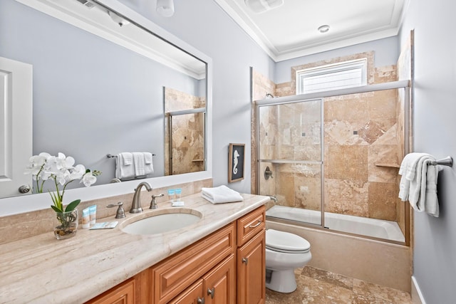 full bathroom with toilet, enclosed tub / shower combo, crown molding, and vanity