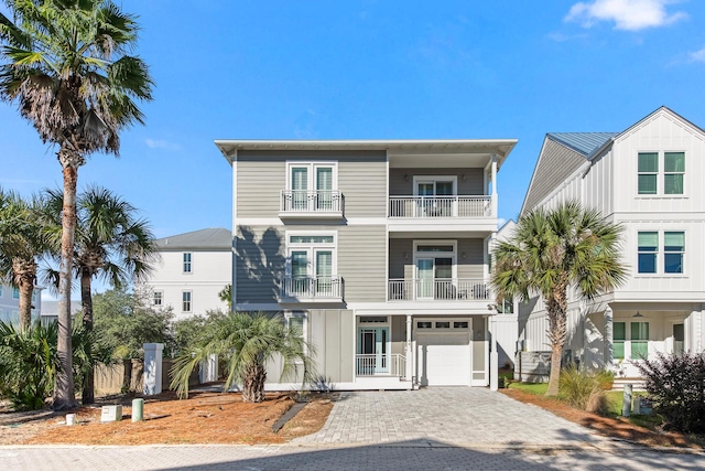 view of front of house with a balcony and a garage