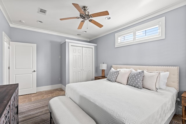 bedroom featuring a closet, ceiling fan, and crown molding