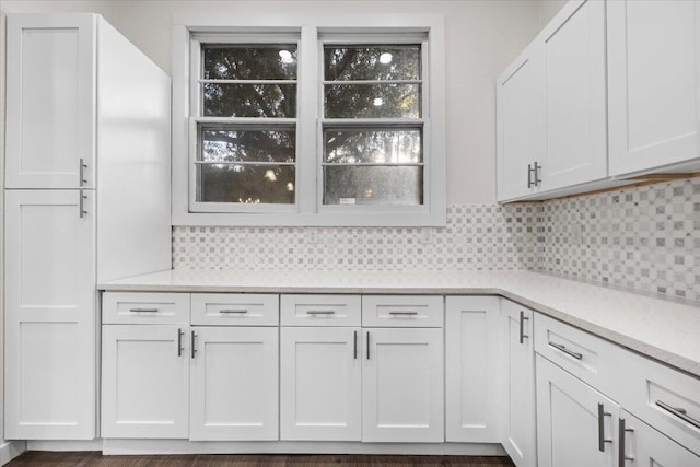 interior space featuring white cabinetry and decorative backsplash