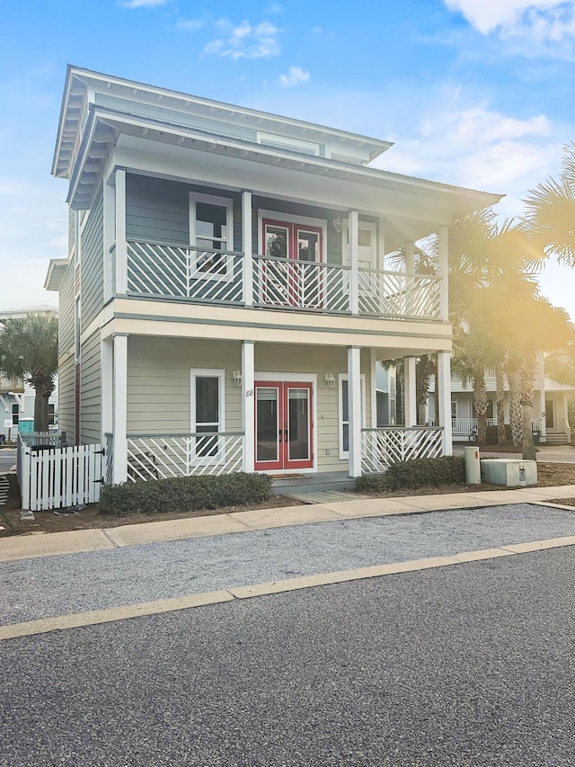 view of front facade featuring french doors and a balcony