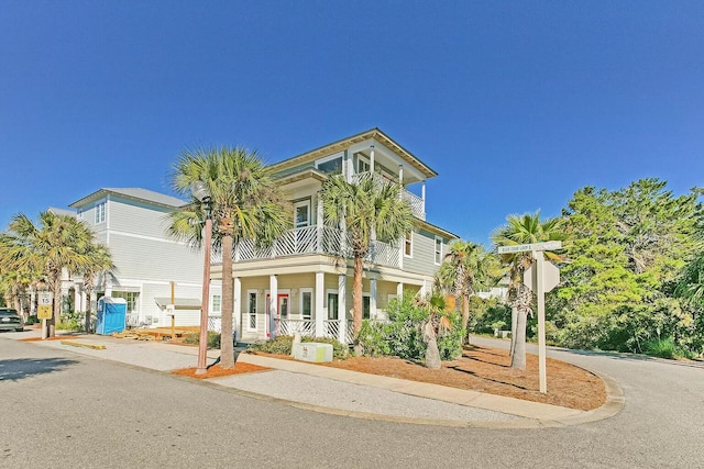 view of front of house with a balcony