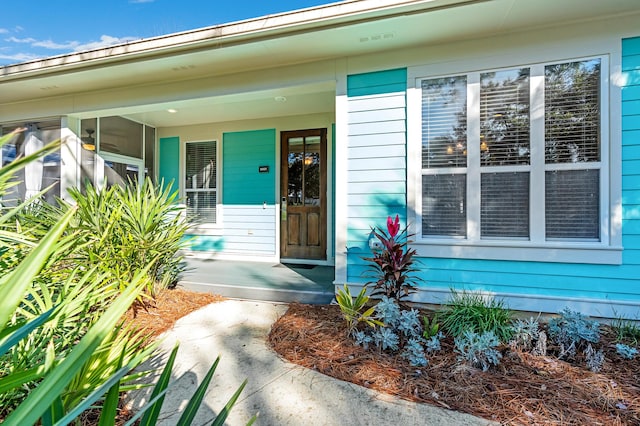 doorway to property featuring a porch