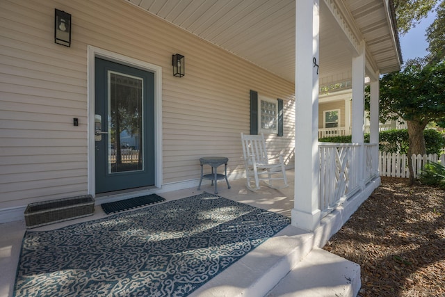 doorway to property with a porch