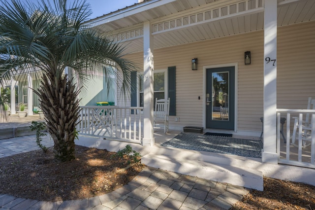 doorway to property with covered porch