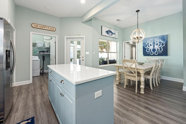 kitchen featuring an inviting chandelier, dark hardwood / wood-style floors, stainless steel refrigerator with ice dispenser, a kitchen island, and decorative light fixtures