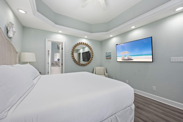 bedroom featuring dark wood-type flooring, ceiling fan, and connected bathroom