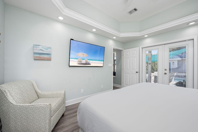 bedroom featuring dark hardwood / wood-style floors, access to outside, and french doors