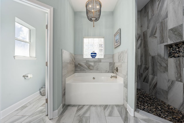 bathroom with an inviting chandelier and plus walk in shower