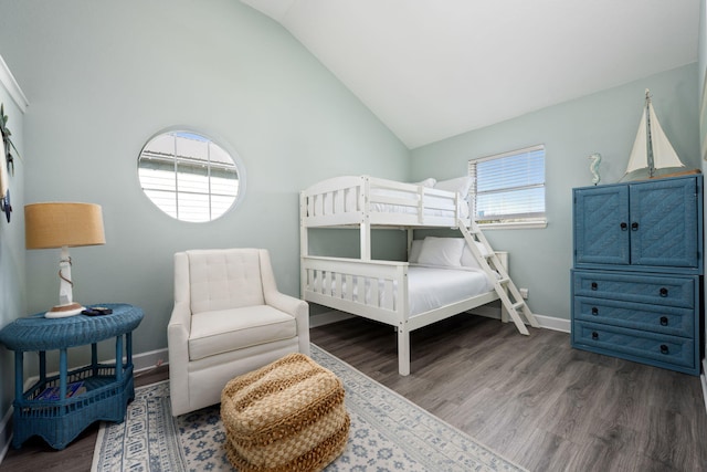 bedroom featuring vaulted ceiling and dark hardwood / wood-style floors