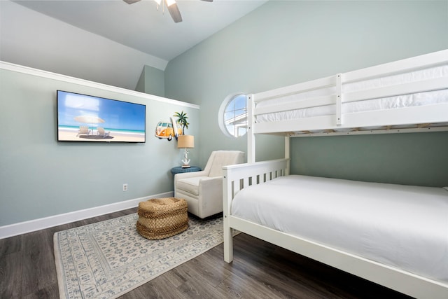 bedroom with hardwood / wood-style flooring, vaulted ceiling, and ceiling fan