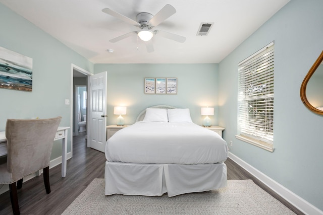 bedroom with ceiling fan and dark hardwood / wood-style floors