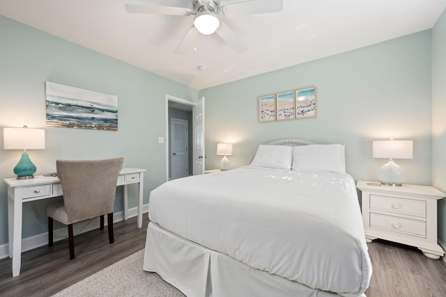 bedroom with dark wood-type flooring and ceiling fan