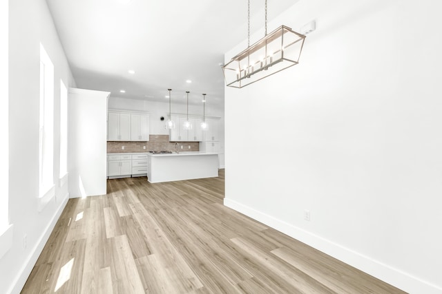 unfurnished living room with light wood-type flooring