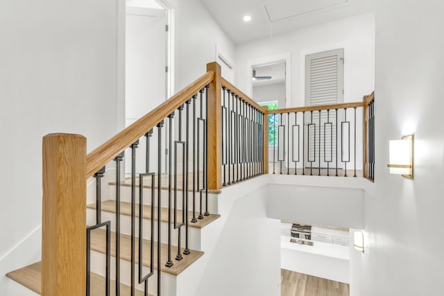 staircase with wood-type flooring