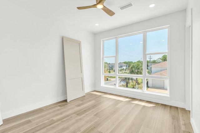 unfurnished room with ceiling fan and light hardwood / wood-style flooring