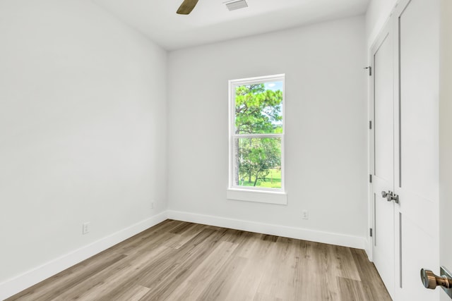 unfurnished room featuring ceiling fan and light hardwood / wood-style floors