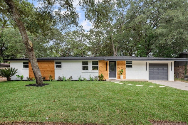 ranch-style house with a front lawn and a garage