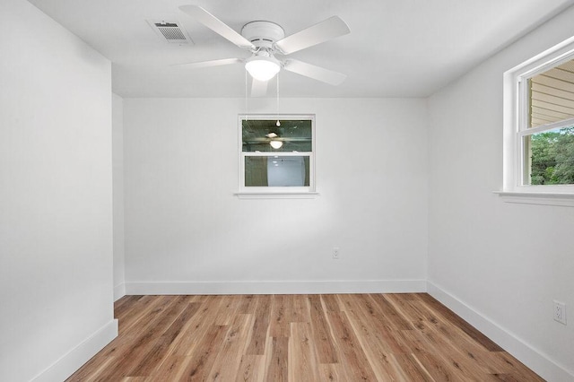 spare room featuring ceiling fan and light hardwood / wood-style floors