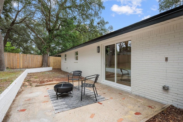 view of patio / terrace featuring a fire pit