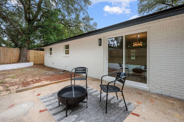 view of patio / terrace featuring an outdoor fire pit