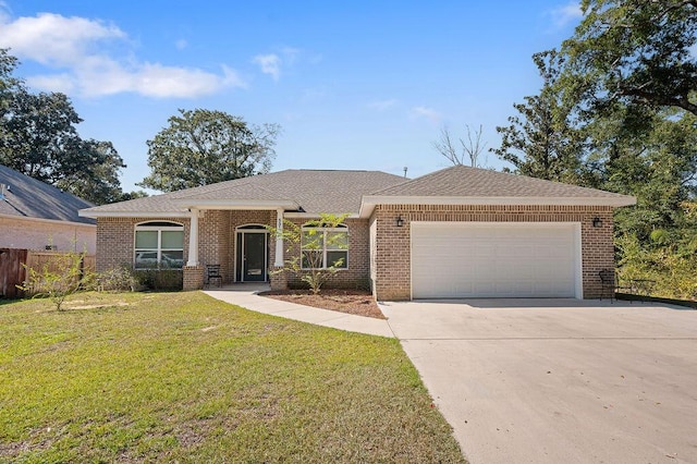 ranch-style house featuring a front yard and a garage