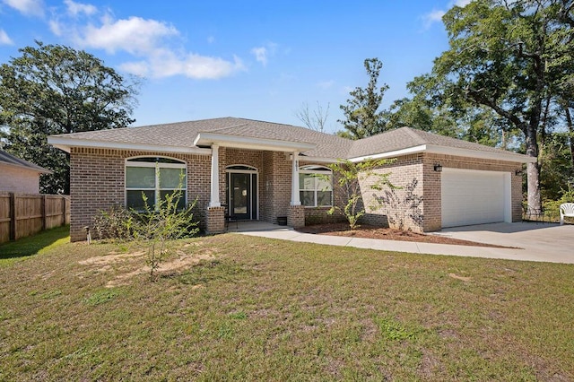 single story home with a front yard and a garage