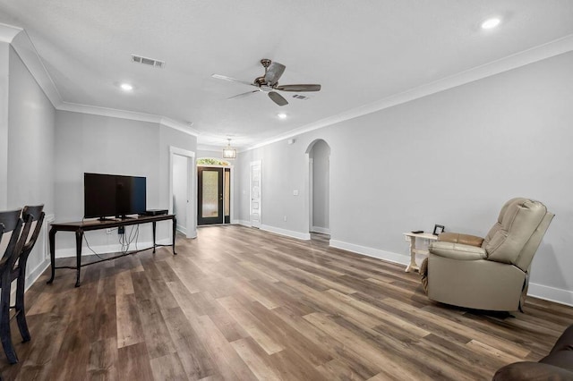 sitting room featuring ceiling fan, hardwood / wood-style floors, and crown molding