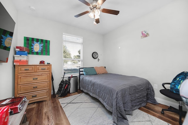 bedroom featuring light wood-type flooring and ceiling fan