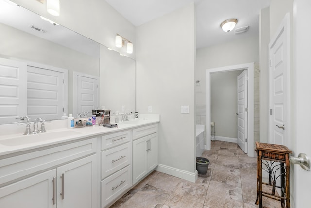 bathroom with vanity and a bathing tub