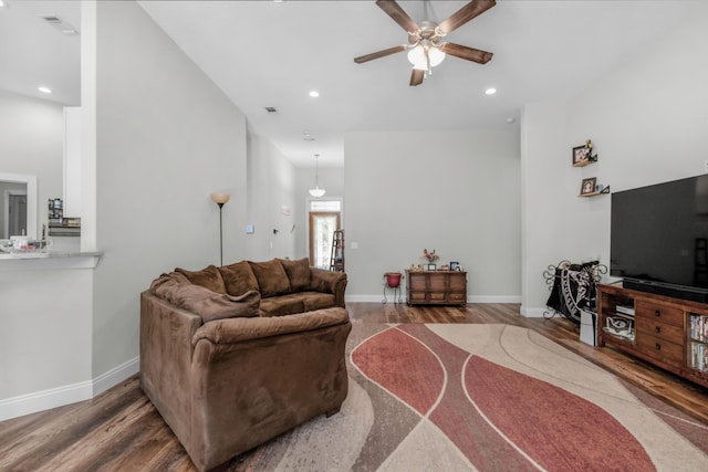 living room featuring ceiling fan and wood-type flooring