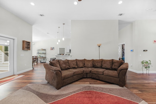 living room with dark hardwood / wood-style flooring