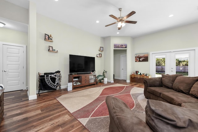 living room featuring dark wood-type flooring, ceiling fan, and french doors