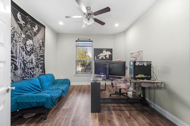 office area with dark wood-type flooring and ceiling fan