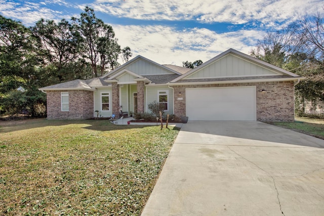 view of front of property with a front yard and a garage