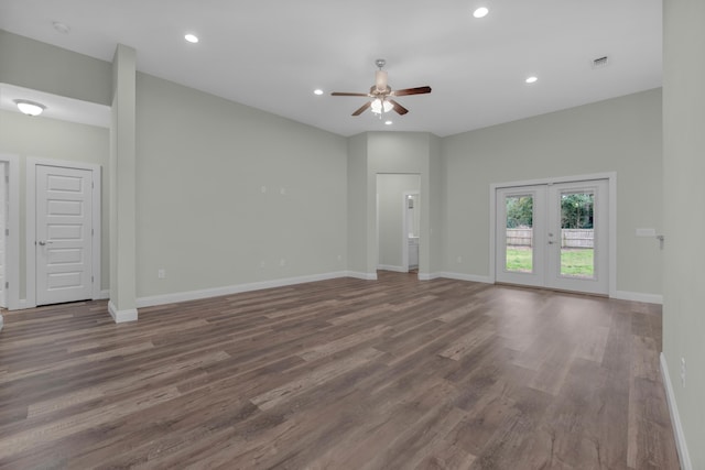 unfurnished living room featuring baseboards, french doors, wood finished floors, and recessed lighting