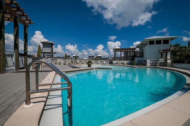 view of swimming pool featuring a pergola and a patio