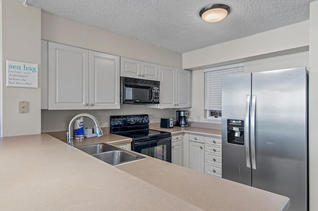 kitchen featuring sink, white cabinets, a textured ceiling, and black appliances