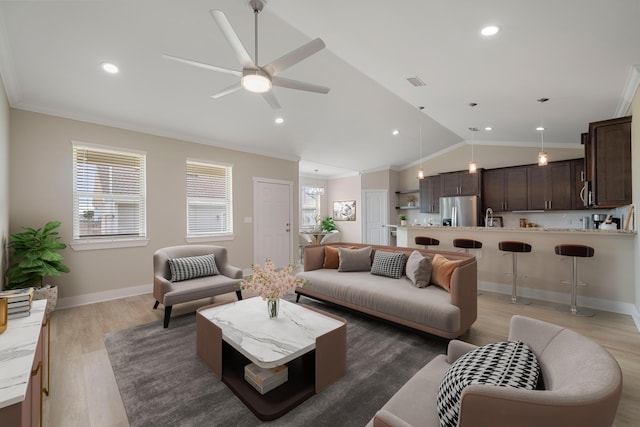 living room featuring dark wood-type flooring, lofted ceiling, plenty of natural light, and ceiling fan