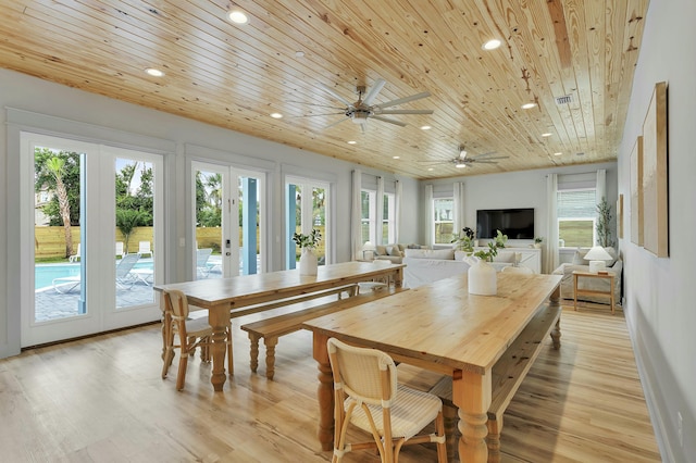 dining space featuring french doors, wooden ceiling, ceiling fan, and light hardwood / wood-style floors