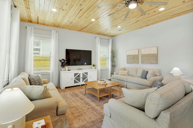 living room with wooden ceiling and ceiling fan