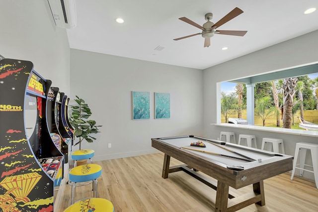 rec room featuring billiards, light wood-type flooring, ceiling fan, and a wall mounted AC