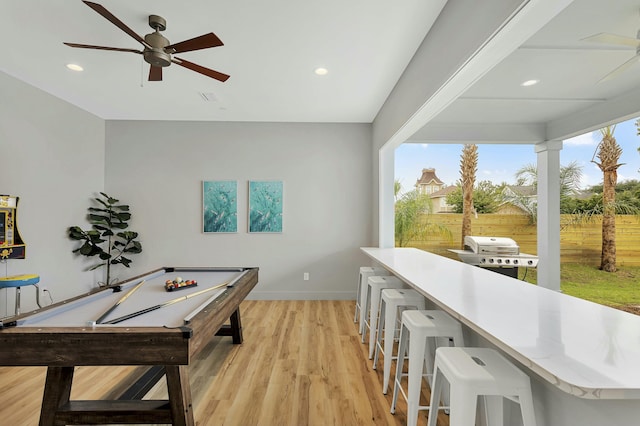 playroom featuring pool table, ceiling fan, and light hardwood / wood-style flooring