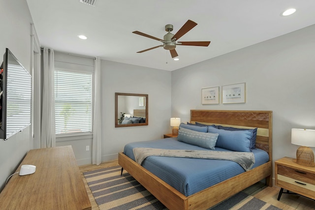 bedroom featuring hardwood / wood-style flooring and ceiling fan