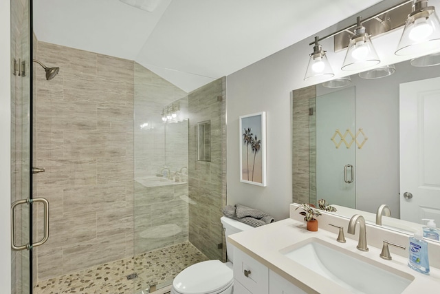 bathroom with toilet, an enclosed shower, vanity, and lofted ceiling