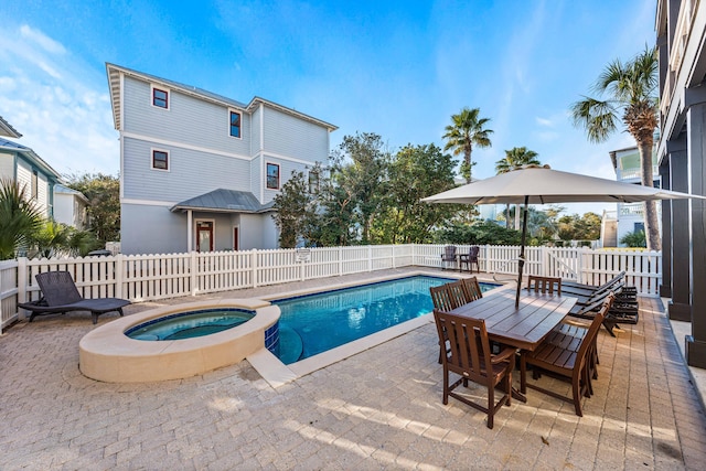 view of pool featuring an in ground hot tub and a patio area